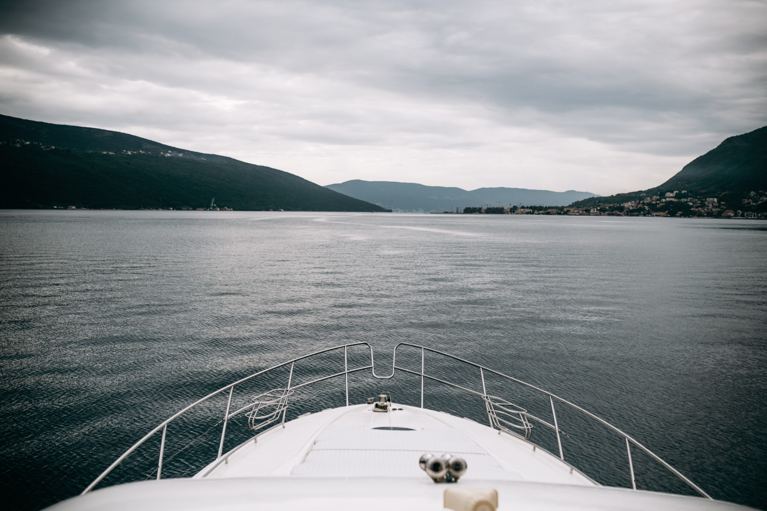 Tip of a yacht pointing toward the open ocean, representing durability and performance required for marine zippers in harsh environments.